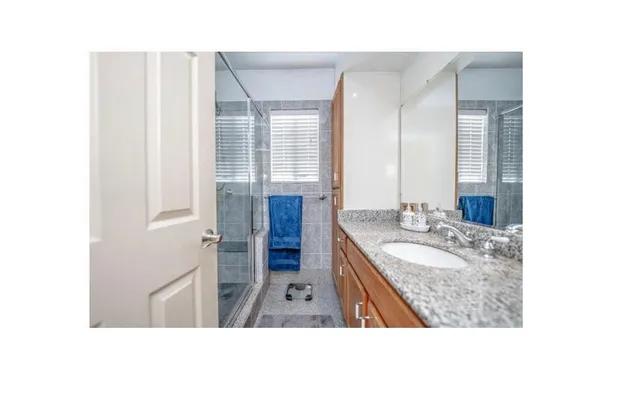 a kitchen with a refrigerator and cabinets