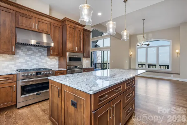 a kitchen with a stove and a sink