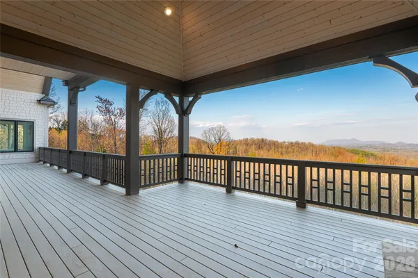a view of a balcony with wooden floor