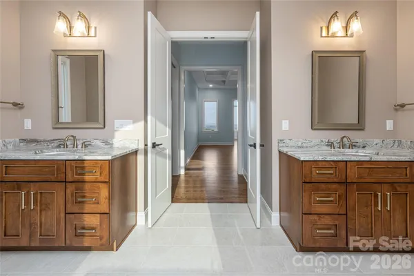 a bathroom with a sink vanity and mirror
