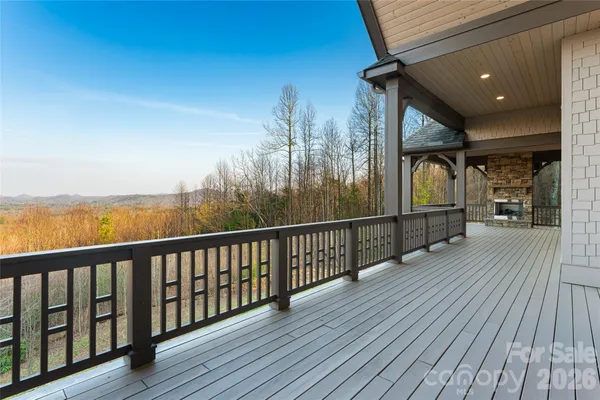 a view of a balcony with wooden floor