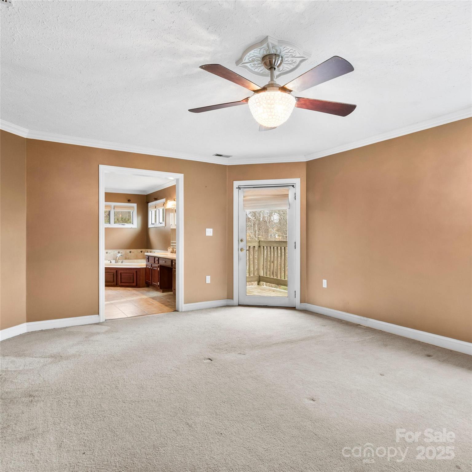 2 Sun Up Lane Candler, NC 28715 - Photo 21 of 30 an empty room with chandelier fan and windows