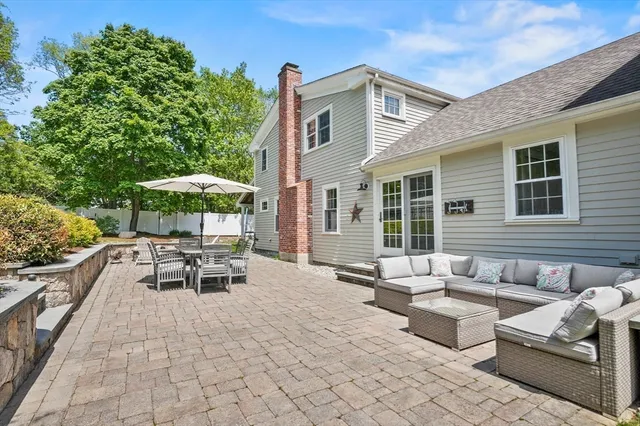 an aerial view of a house with garden space and street view