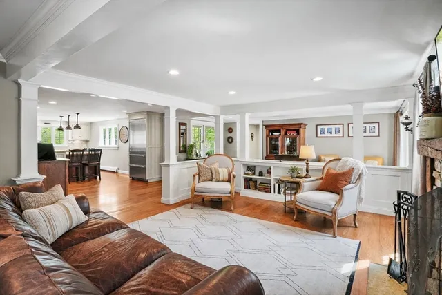 a living room with furniture or couch and a wooden floor