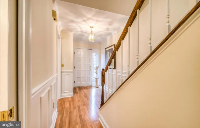 a view of an entryway with wooden floor