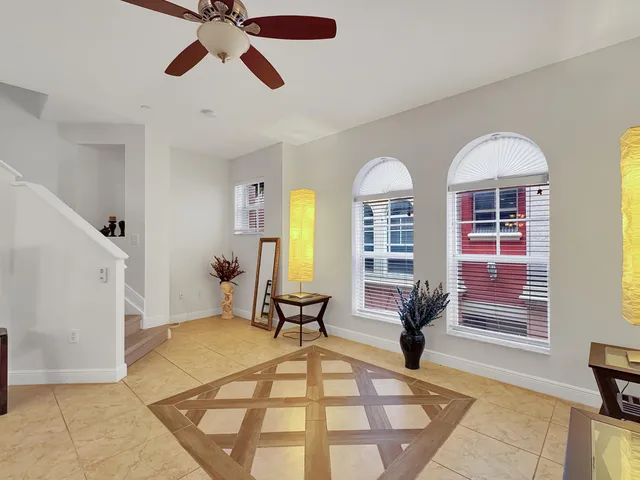a view of hall way with furniture and windows