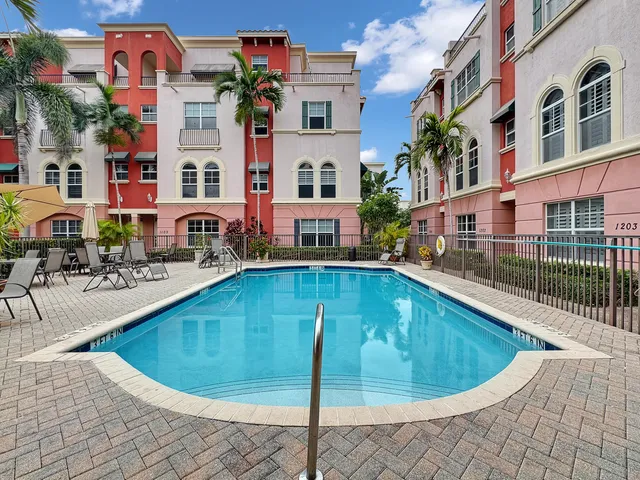 a view of a swimming pool with a patio