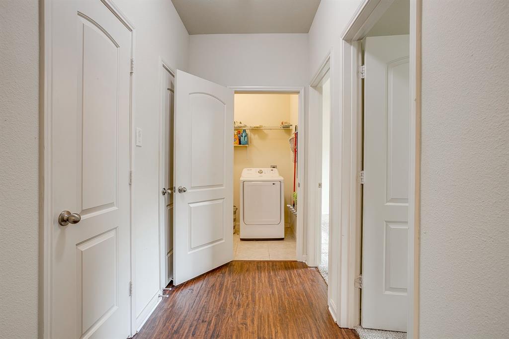 136 Kennedy Drive Venus, TX 76084 - Photo 19 of 27 a view of a hallway with wooden floor and closet area