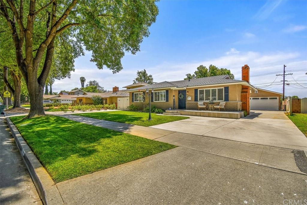 6715 Nicolett Street Riverside, CA 92504 - Photo 1 of 1 a front view of a house with a yard