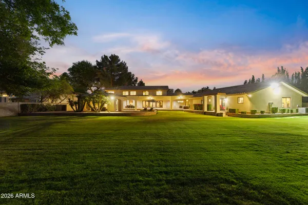 a kitchen with stainless steel appliances granite countertop a stove oven and a refrigerator