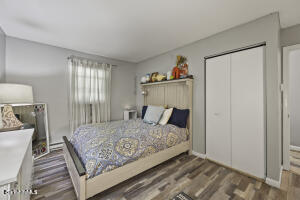 1052 Beaver Pond Road Williamstown, MA 01267 - Photo 14 of 37 a bedroom with a bed and wooden floor