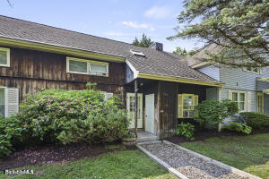 1052 Beaver Pond Road Williamstown, MA 01267 - Photo 2 of 37 a front view of a house with a garden