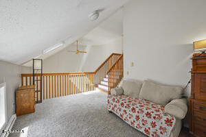 1052 Beaver Pond Road Williamstown, MA 01267 - Photo 22 of 37 a living room with furniture and stairs