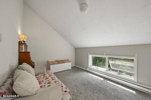 1052 Beaver Pond Road Williamstown, MA 01267 - Photo 23 of 37 a bedroom with a bed and a large window