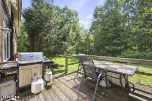 1052 Beaver Pond Road Williamstown, MA 01267 - Photo 27 of 37 a backyard of a house with table and chairs