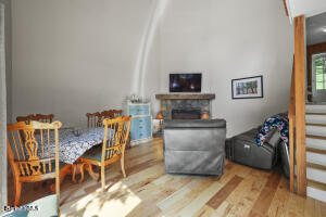 1052 Beaver Pond Road Williamstown, MA 01267 - Photo 3 of 37 a living room with furniture and a flat screen tv
