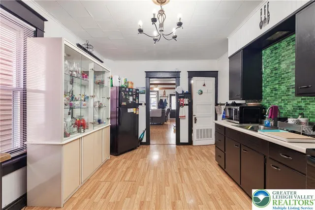 a kitchen with stainless steel appliances kitchen island a refrigerator and a stove