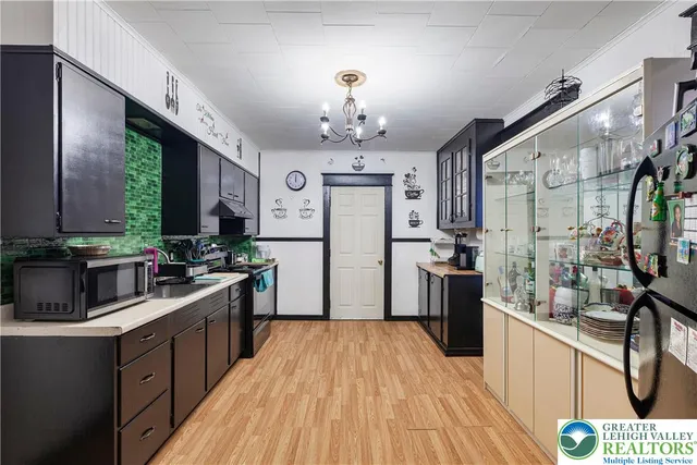 a kitchen with a sink and cabinets