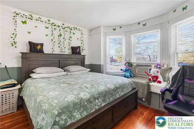 a bedroom with a bed and window