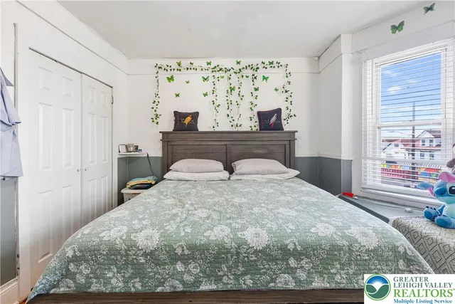 a bed room with a bed and a couch