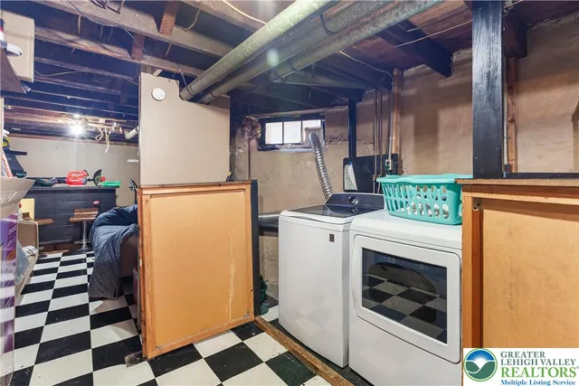 a view of entryway with furniture and a rug