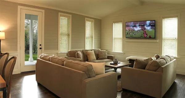 a living room with furniture and a large window