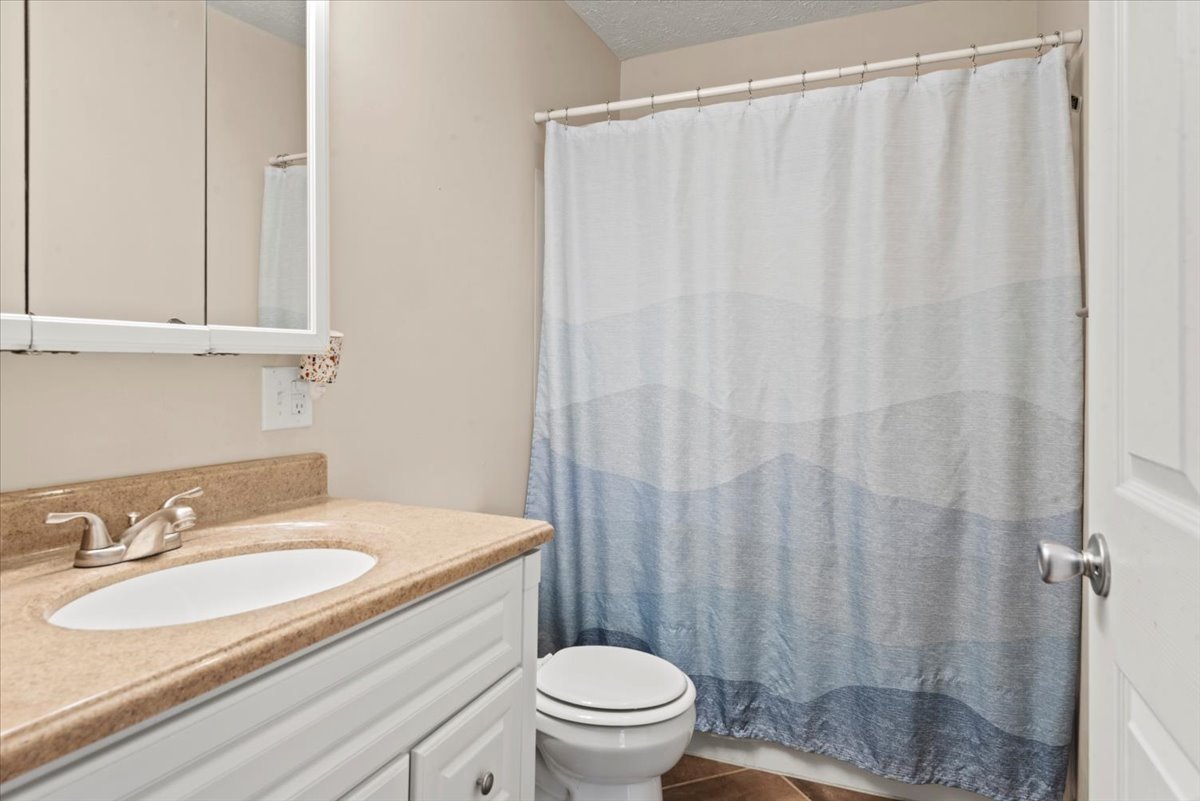 15 Mesa Road Springfield, IL 62702 - Photo 15 of 42 a bathroom with a sink toilet and shower