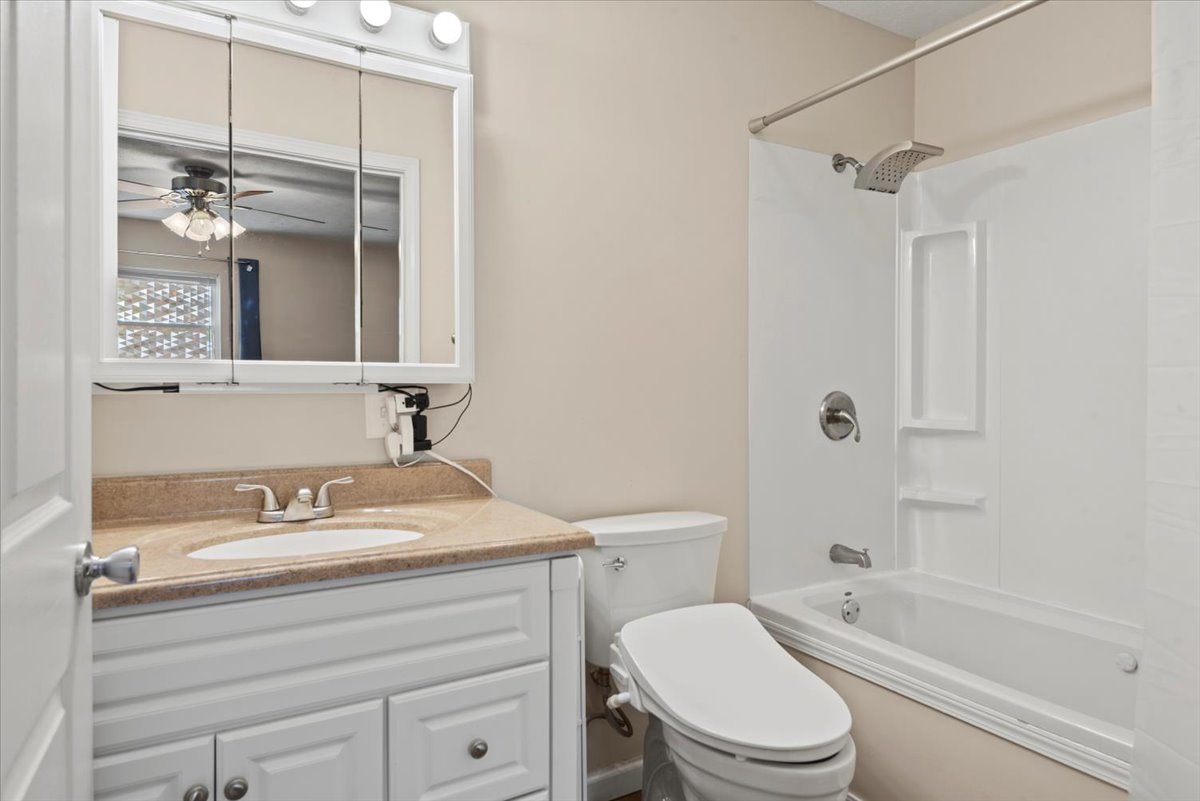15 Mesa Road Springfield, IL 62702 - Photo 18 of 42 a bathroom with a sink a toilet and shower