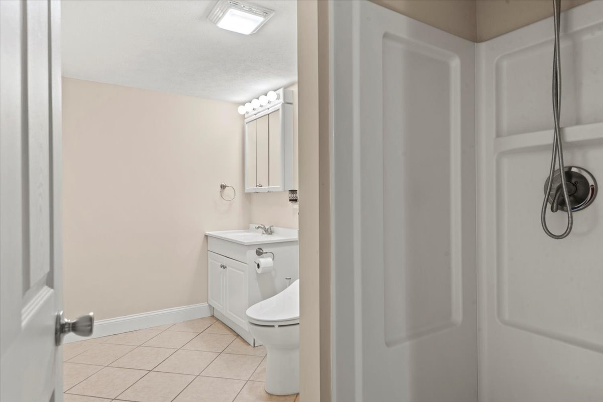 15 Mesa Road Springfield, IL 62702 - Photo 33 of 42 a bathroom with a toilet a sink a vanity and mirror
