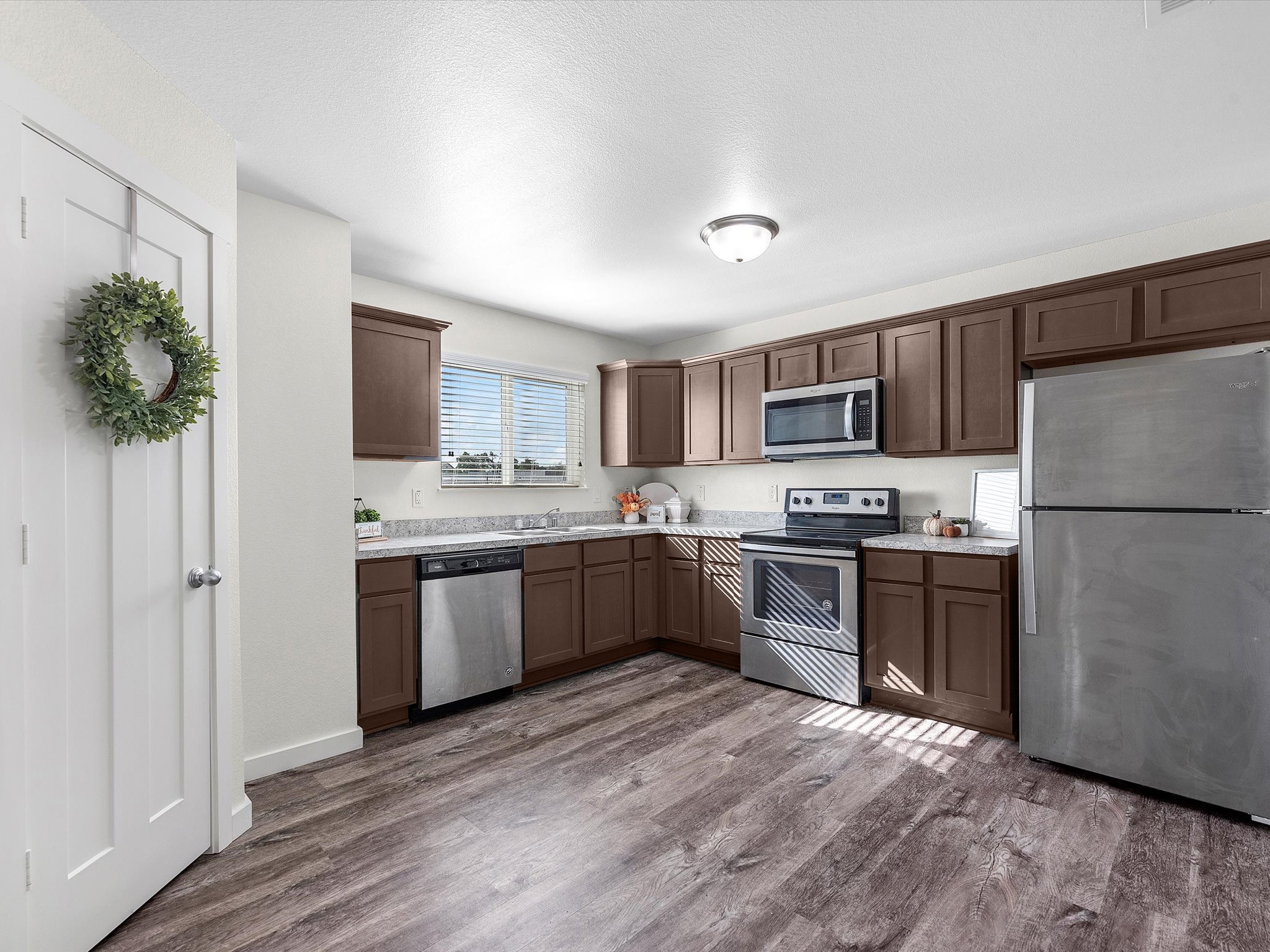 12603 Telge Road, Unit 31 EH Cypress, TX 77429 - Photo 12 of 38 a large kitchen with a refrigerator stove microwave and sink