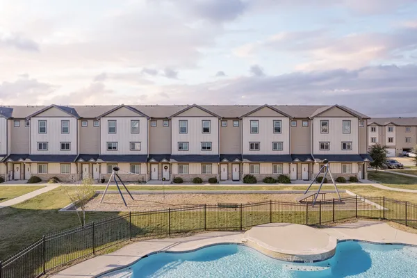 a view of a swimming pool with a patio