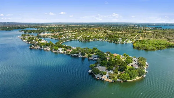 an aerial view of a house with a lake view