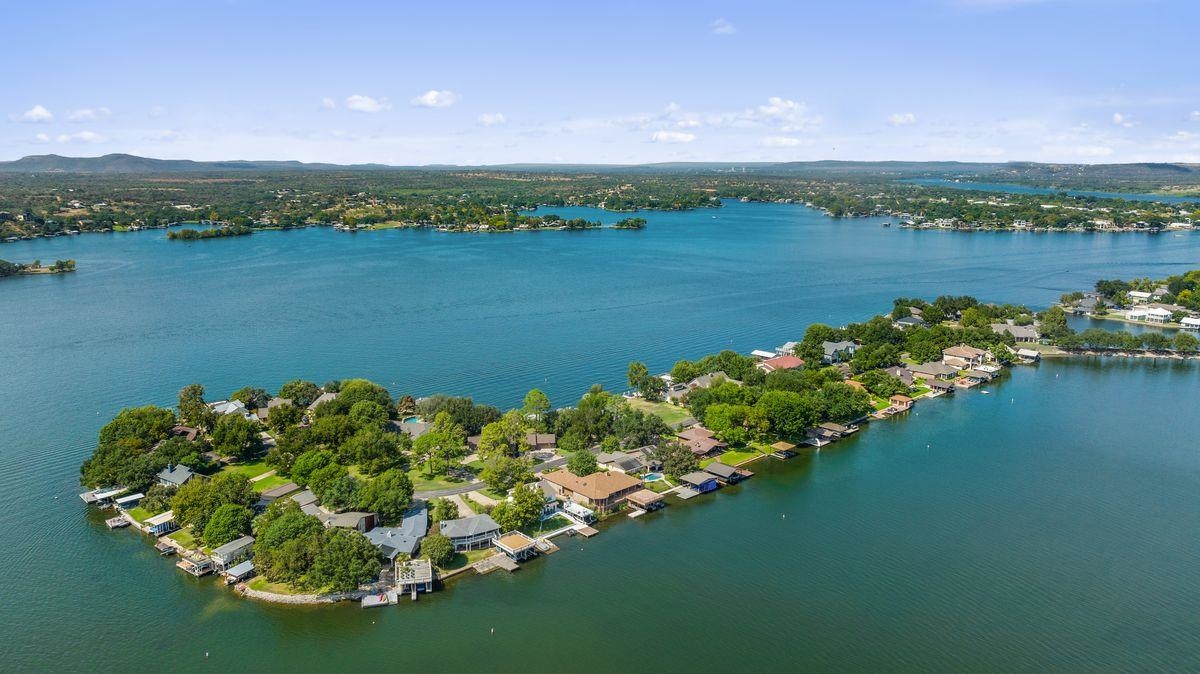 30 Beaver Island Road Granite Shoals, TX 78654 - Photo 3 of 22 a view of a lake with a mountain in the background