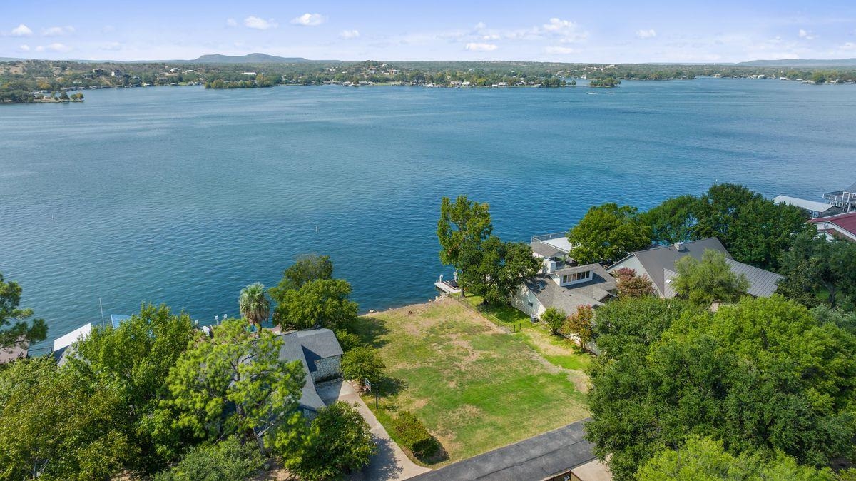 30 Beaver Island Road Granite Shoals, TX 78654 - Photo 9 of 22 a view of a lake with a mountain in the background