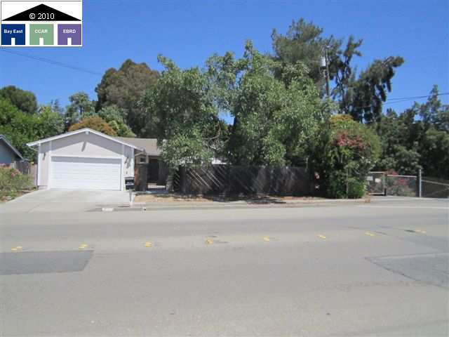 912 Bancroft Road Concord, CA 94518 - Photo 1 of 1 a house with a yard and a car parked on road