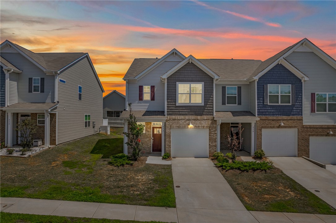 432 Bee Cv Way Pendleton, SC 29670 - Photo 2 of 39 This charming townhouse features a classic facade, welcoming you with a blend of brick and siding.