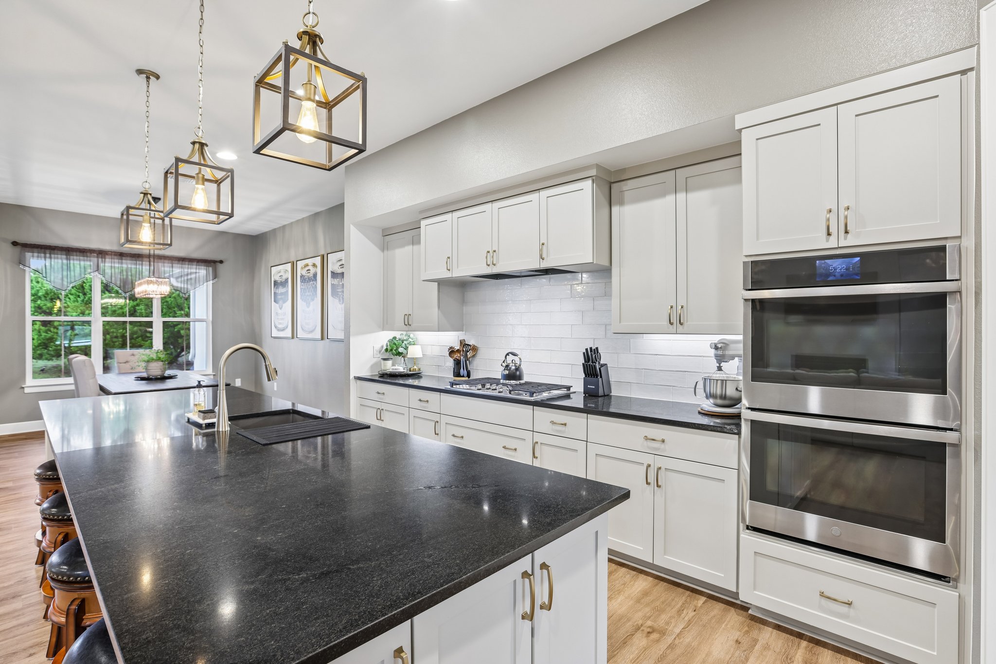 113 Crystal Lane Georgetown, TX 78633 - Photo 16 of 32 A chef's kitchen showcasing a large island with sink, ample cabinetry, and integrated appliances.
