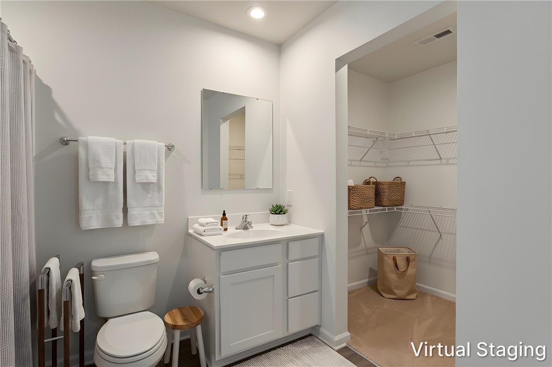 137 Nicklaus Drive Anderson, SC 29621 - Photo 22 of 37 A well-lit bathroom provides direct access to a functional walk-in closet with ample storage solutions.