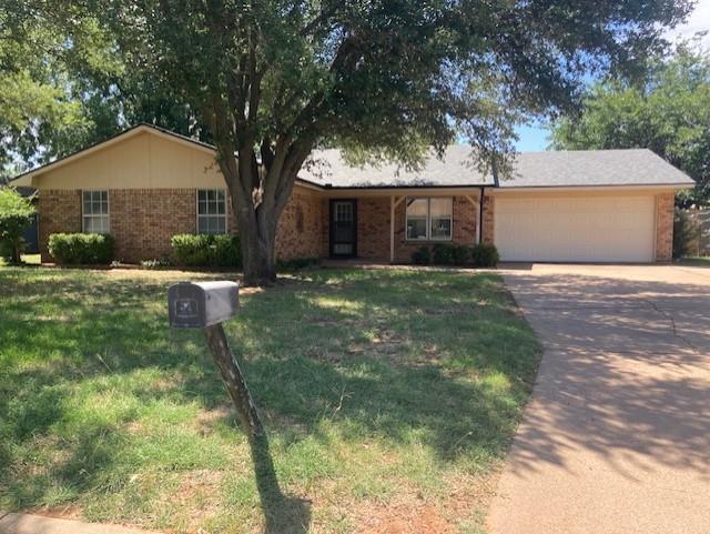 1202 Randy Drive Graham, TX 76450 - Photo 1 of 32 Nice shade tree in the front yard.
