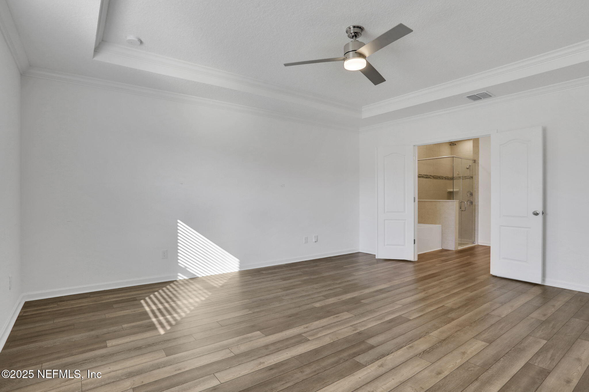 3209 Crocus Ln Green Cove Springs Green Cove Springs, FL 32043 - Photo 16 of 35 a view of an empty room with window and wooden floor