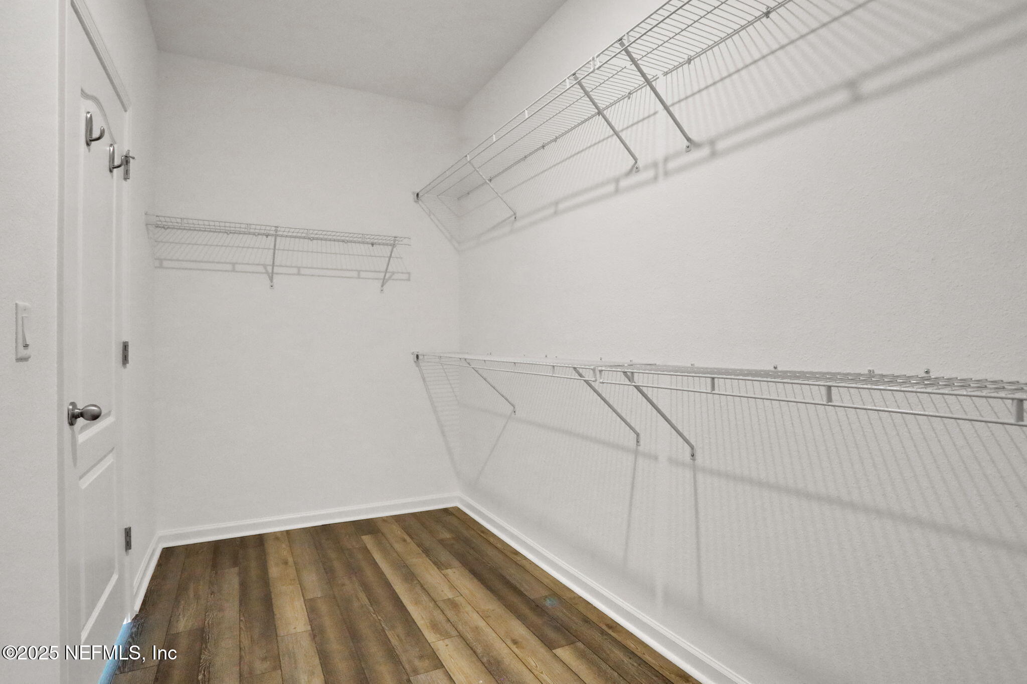 3209 Crocus Ln Green Cove Springs Green Cove Springs, FL 32043 - Photo 17 of 35 a view of a room with racks on the wall