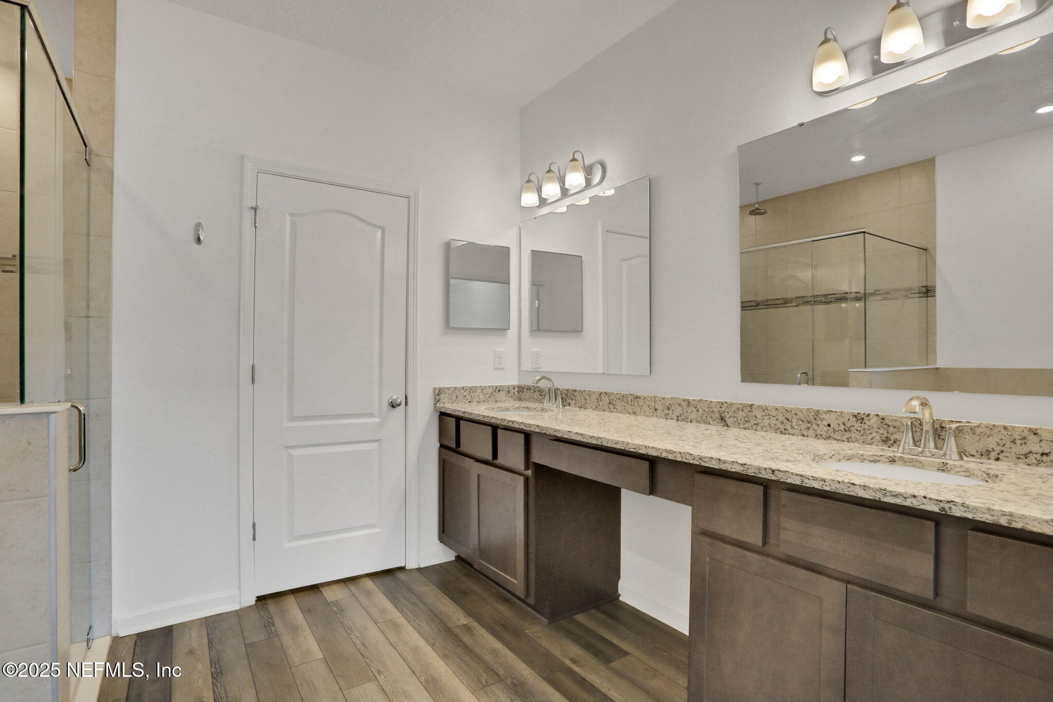 3209 Crocus Ln Green Cove Springs Green Cove Springs, FL 32043 - Photo 18 of 35 a bathroom with a granite countertop double vanity sink and a mirror