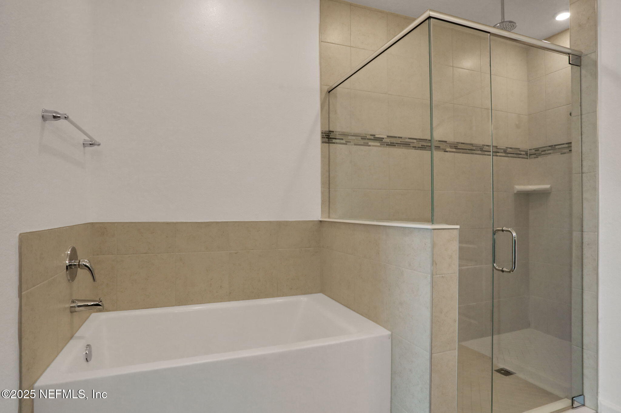 3209 Crocus Ln Green Cove Springs Green Cove Springs, FL 32043 - Photo 19 of 35 a bathroom with a bathtub and a shower