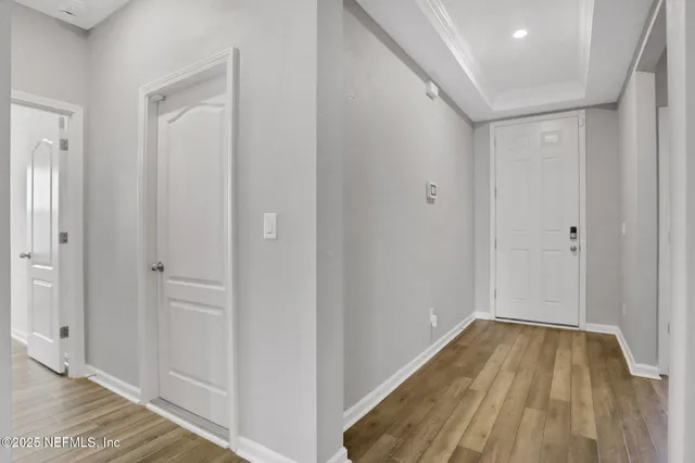 a view of a bathroom with wooden floor and a sink