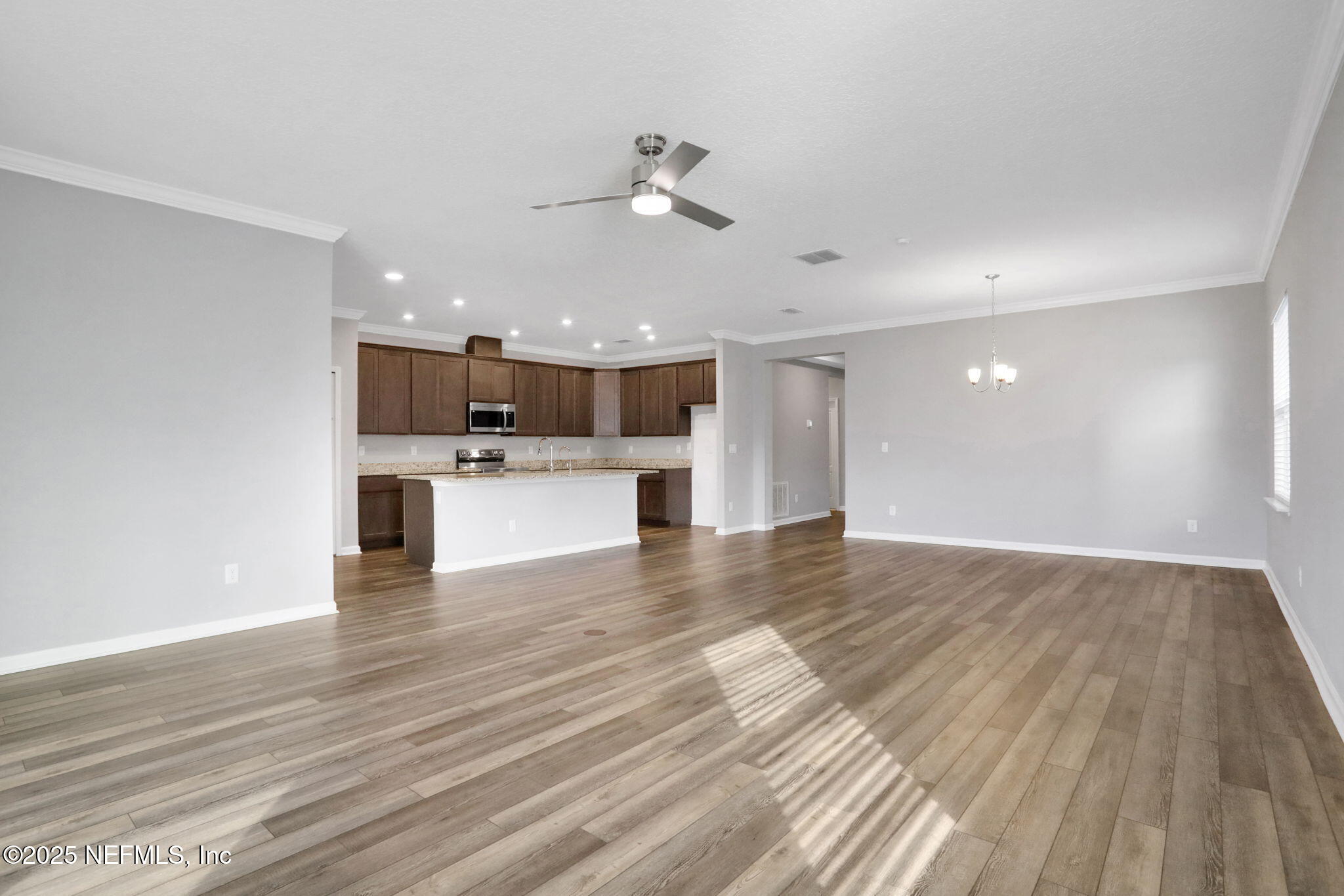 3209 Crocus Ln Green Cove Springs Green Cove Springs, FL 32043 - Photo 4 of 35 a view of a kitchen with a sink and wooden floor