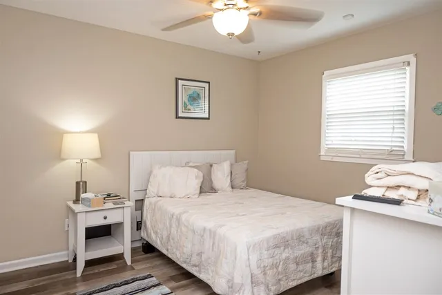 a bedroom with a bed and a lamp