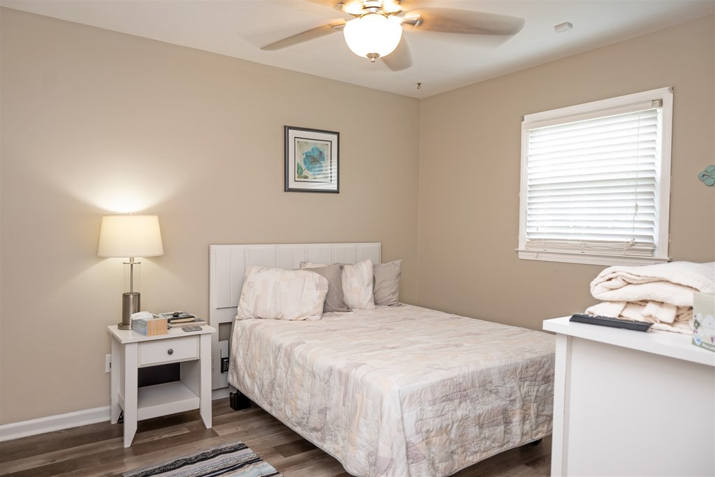 6534 Natha Avenue Columbus, GA 31909 - Photo 13 of 13 a bedroom with a bed and a lamp