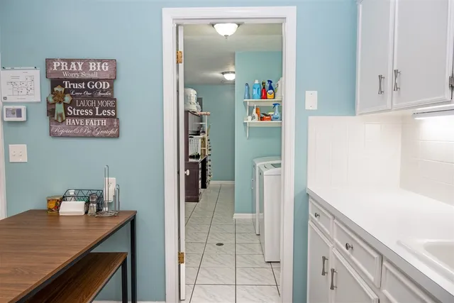 a view of kitchen with furniture and wooden floor