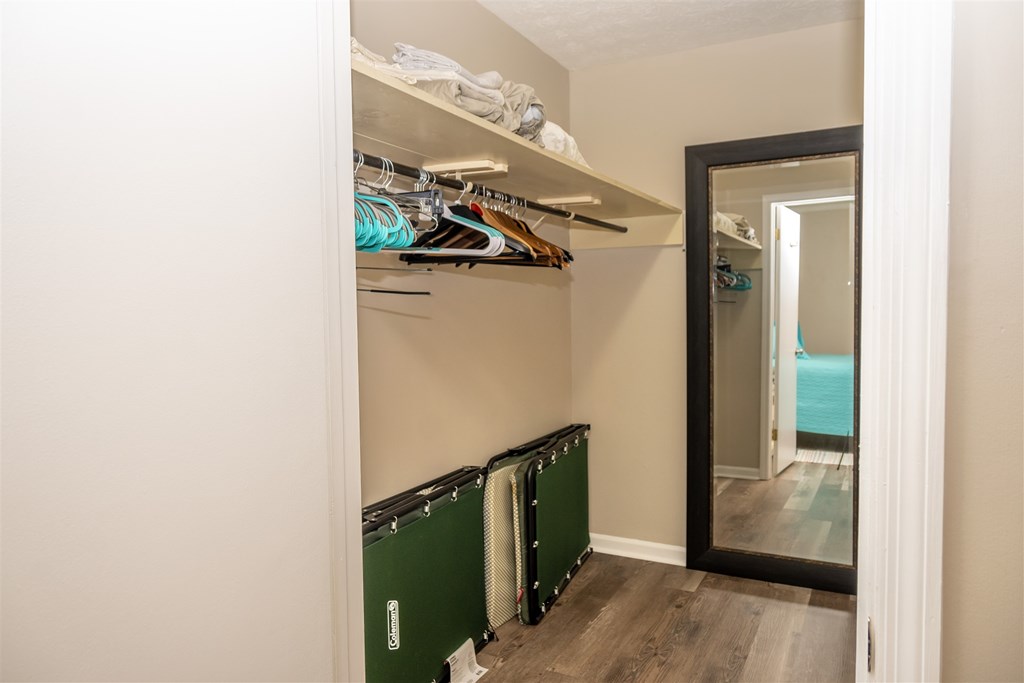 6534 Natha Avenue Columbus, GA 31909 - Photo 8 of 13 a view of a hallway with wooden floor and stairs
