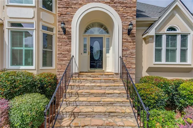 a view of entryway livingroom and hall with wooden floor